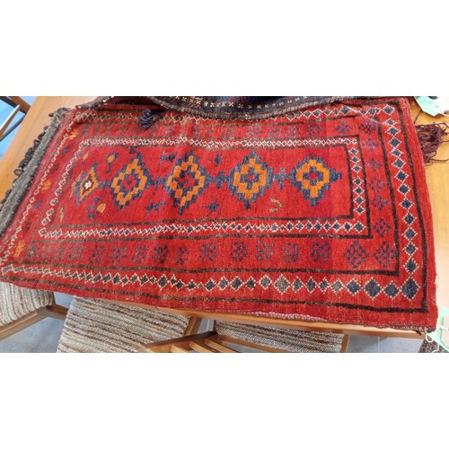 289 - A duo of ethnic carpet bags 114 x 54 and 104 x 51 cm approx