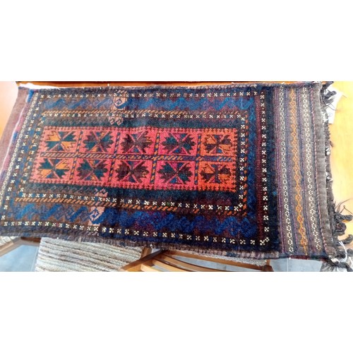 289 - A duo of ethnic carpet bags 114 x 54 and 104 x 51 cm approx