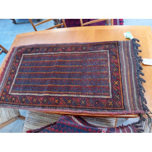 290 - A duo of ethnic carpet bags 123 x 66 and 108 x 54 cm approx