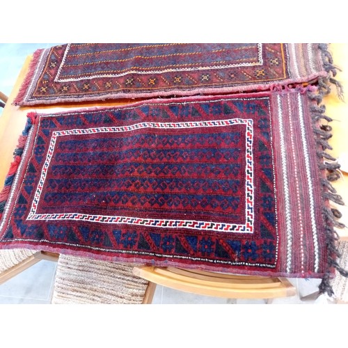 290 - A duo of ethnic carpet bags 123 x 66 and 108 x 54 cm approx