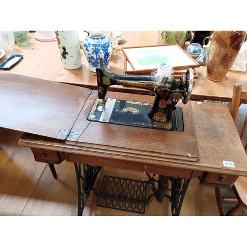 315 - Singer sewing machine on pedestal with 2 drawers