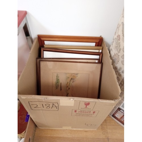 218A - A box of paintings to include T Higgins, Davis and Canadian paintings