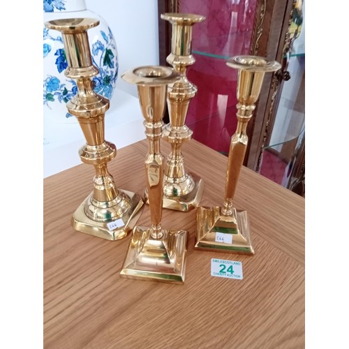 24 - 2 pairs of brass candlesticks