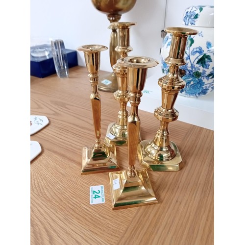 24 - 2 pairs of brass candlesticks