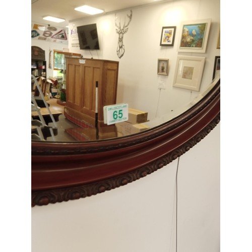 65 - Large bevelled oval mirror