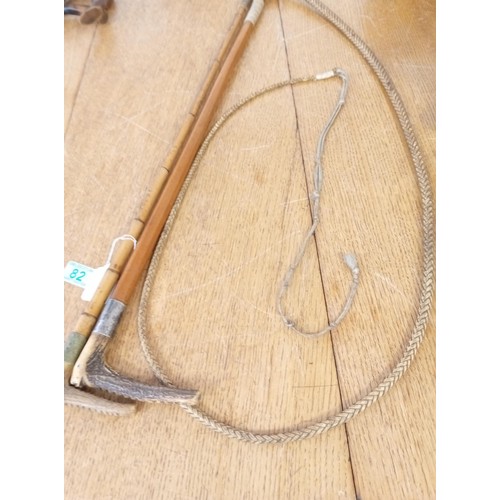 82 - 1 x bamboo hunting whip and 1 cane riding crop both with silver mounts