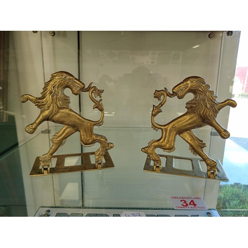34 - A pair of brass lion rampant book ends rare