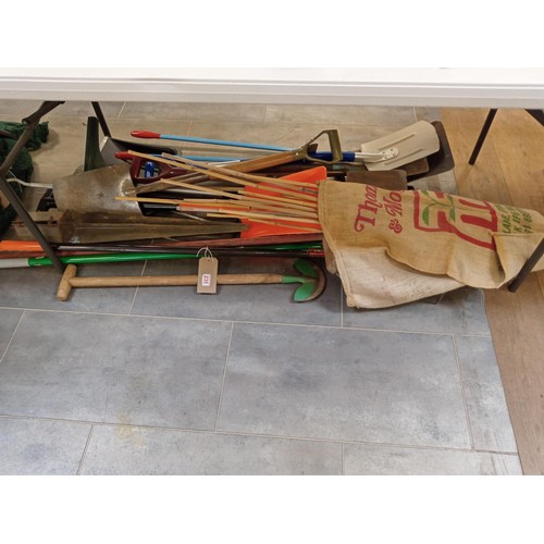 238 - a large selection of garden tools, bamboo etc