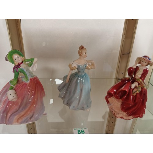 86 - Royal Doulton Figurines.  Autumn Breezes - COPR 1939, Enchantment - HN2178 COPR 1958 and 'Top o' the... 