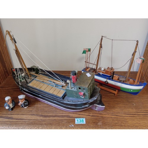 138 - 2 x wooden model boats and sailors