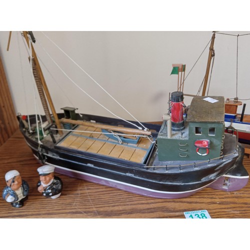 138 - 2 x wooden model boats and sailors