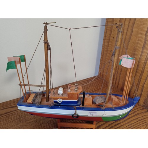 138 - 2 x wooden model boats and sailors