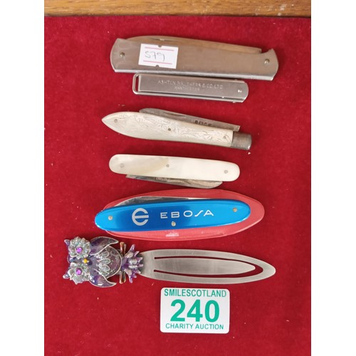 240 - Five pen knives and a bookmark.