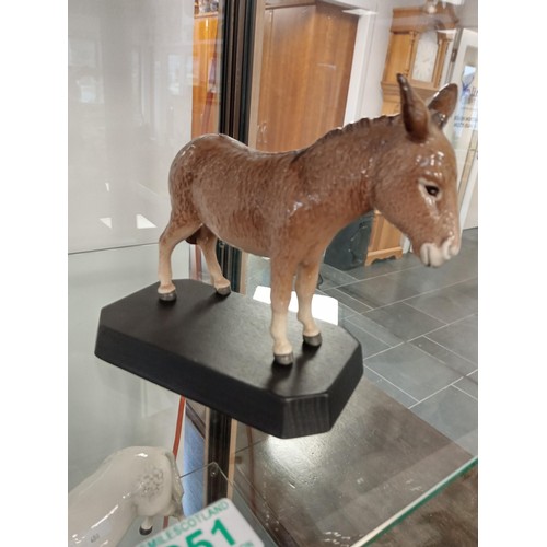 251 - Beswick England Donkey on wooden plinth.