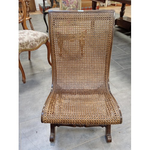 267 - 19th Century X Shape Bergere chair.