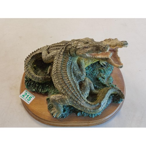 215 - Pair of pottery crocodiles.