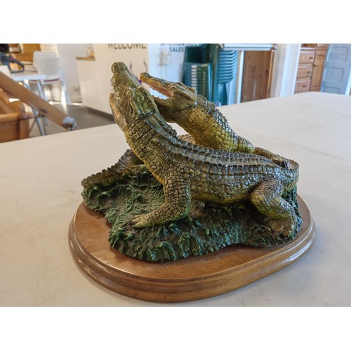 215 - Pair of pottery crocodiles.