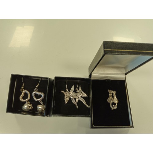 167 - 3 pieces of  jewellery some marked silver, to include pixie earrings, cat broach etc