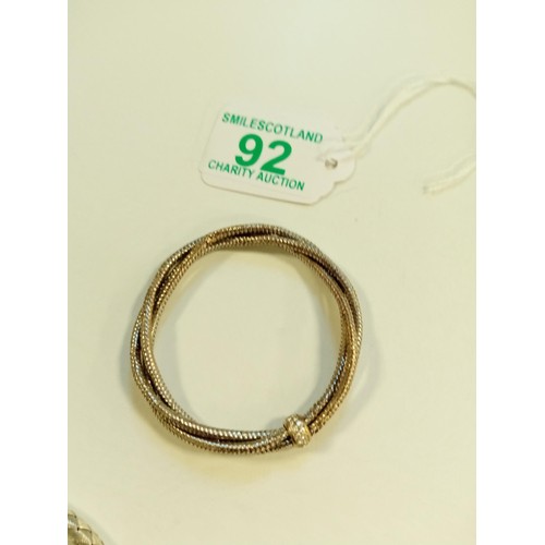 92 - 2x white metal bracelets