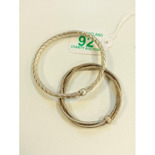 92 - 2x white metal bracelets