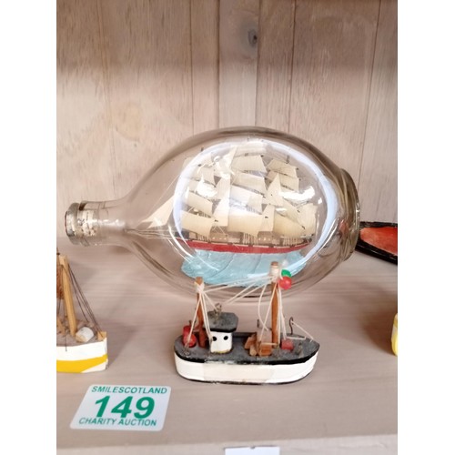 149 - Model boats, lighthouses and a ship in a bottle