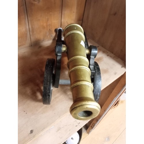 174 - Brass and metal ornamental cannon, 50cm long approx.