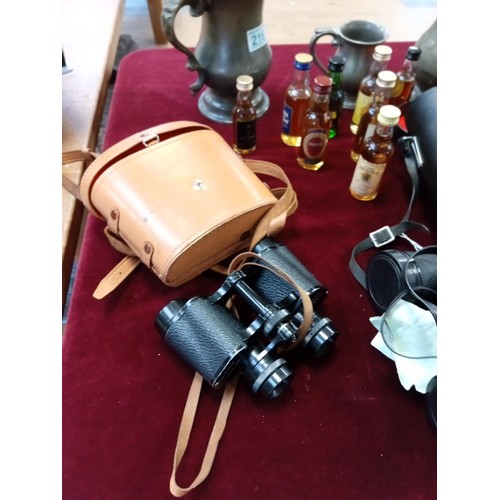 216 - 2x pairs of vintage binoculars, whisky miniatures and pewter jugs