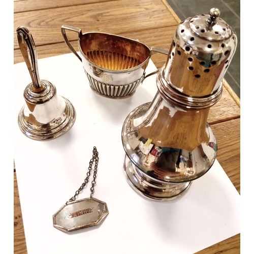 124 - A selection of silver plated items, inc. sugar sifter, bell A/F, sherry tag, sugar bowl