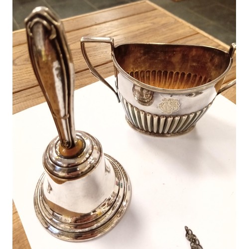 124 - A selection of silver plated items, inc. sugar sifter, bell A/F, sherry tag, sugar bowl