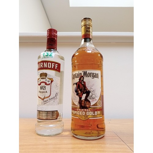 132 - 1 litre Captain Morgans Gold Spiced Rum, plus 70cl Smirnoff Vodka