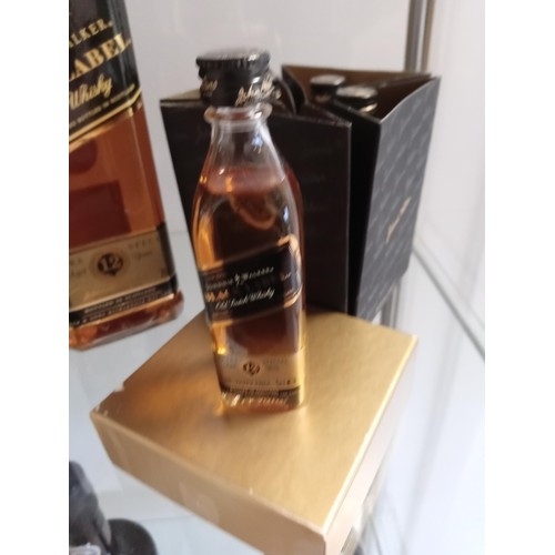 138 - 70cl Johnnie Walker Black Label plus Johnnie Walker miniature black label set