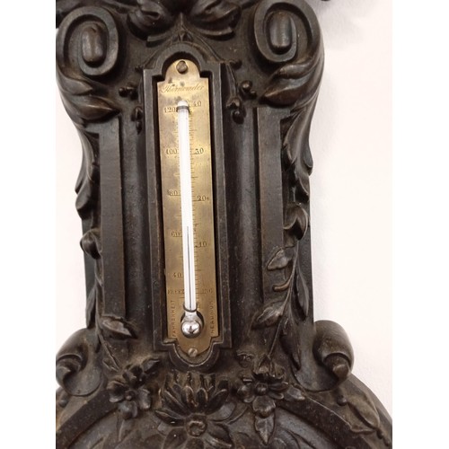 189 - Antique barometer with clock in cast metal