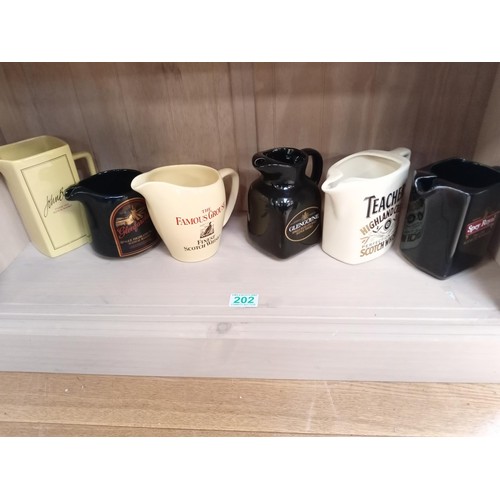 202 - 6 x Pub whisky jugs