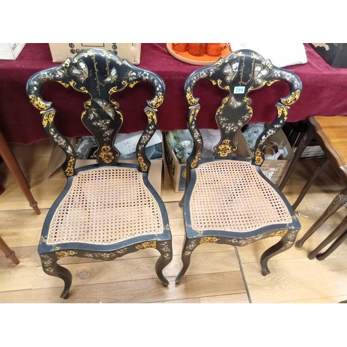 299 - a pair of mother of pearl inlay and Rattan chairs