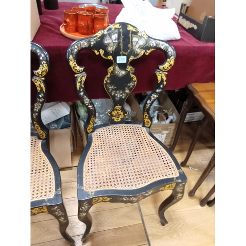 299 - a pair of mother of pearl inlay and Rattan chairs