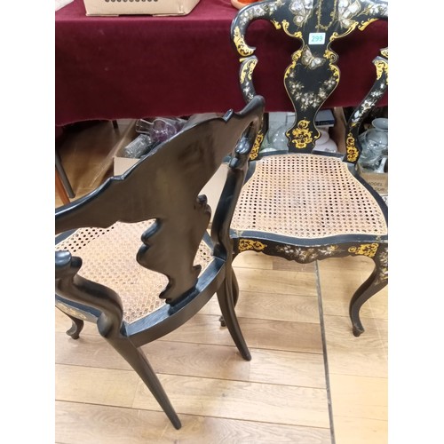 299 - a pair of mother of pearl inlay and Rattan chairs