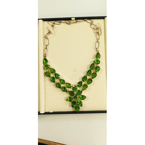 77 - Sterling silver hallmarked necklace with green leaf design