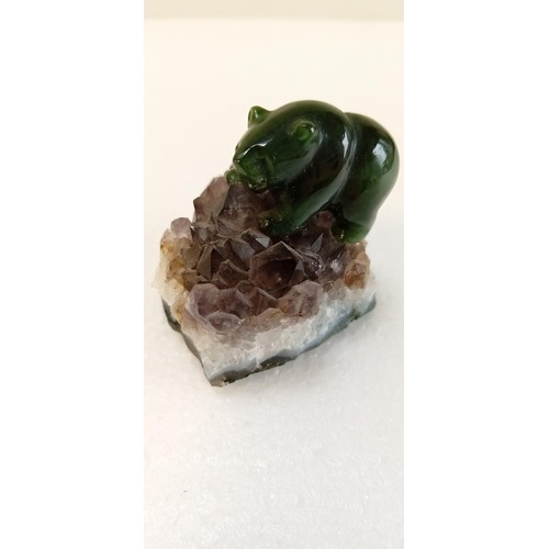 44 - Small jade bear on amethyst cluster