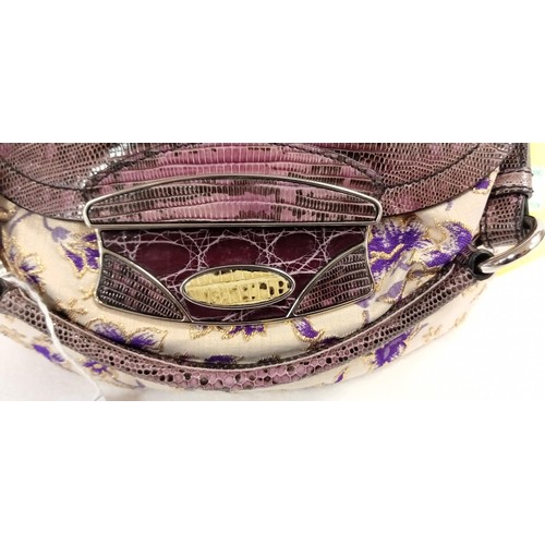 81 - Believed to be Prada purple, Cream & gold hand bag looks unused.  Although we have no provenance thi... 