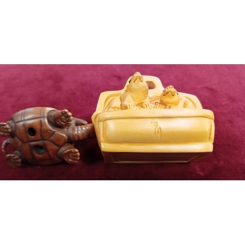 121 - 2x Netsukes (button fasteners) signed inc. tortoise with a snake & mouse/ rat family in a case