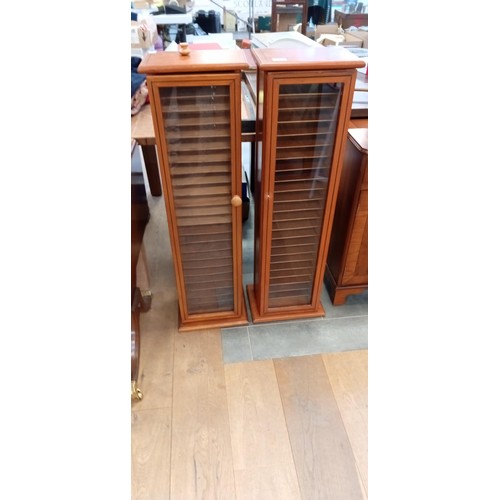 Pair of tall slim glazed hobby cabinets