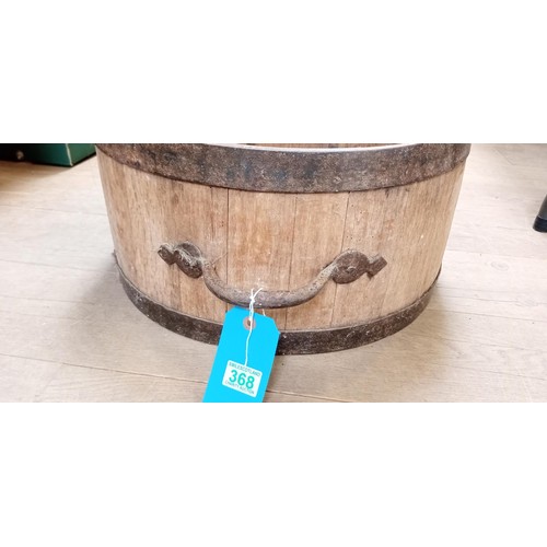 368 - Solid oak bushel with iron handles