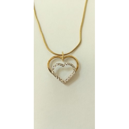 4 - Fully hallmarked 9ct white and yellow gold heart pendant on a yellow metal chain