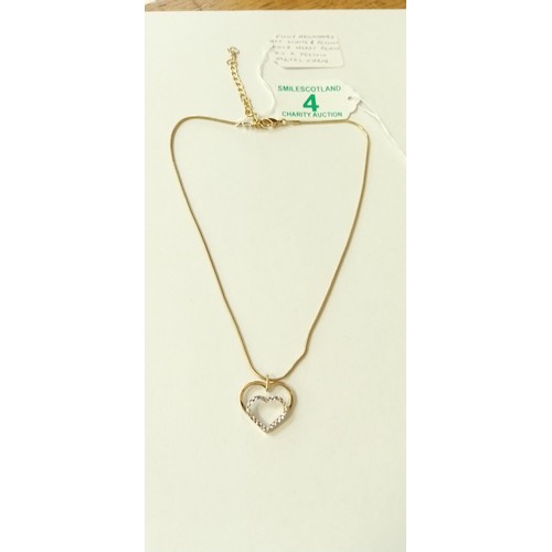 4 - Fully hallmarked 9ct white and yellow gold heart pendant on a yellow metal chain