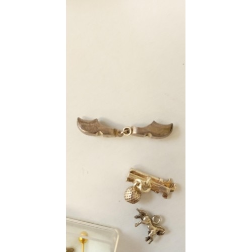 28 - Scrap 9ct gold 0.6g approx. and 3 novelty silver charms