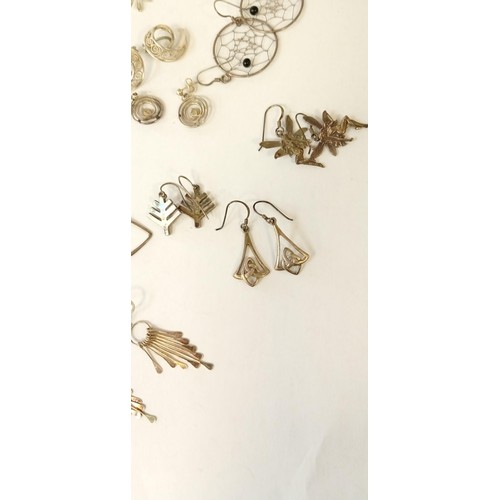 29 - 10 Pairs of silver earrings and 1 matching pendant