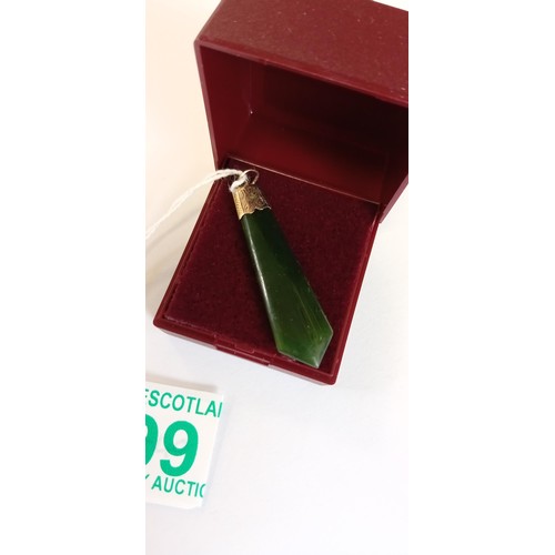 99 - Unmarked but believed gold topped green jade pendant