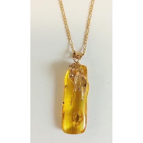 101 - 9ct gold & amber necklace