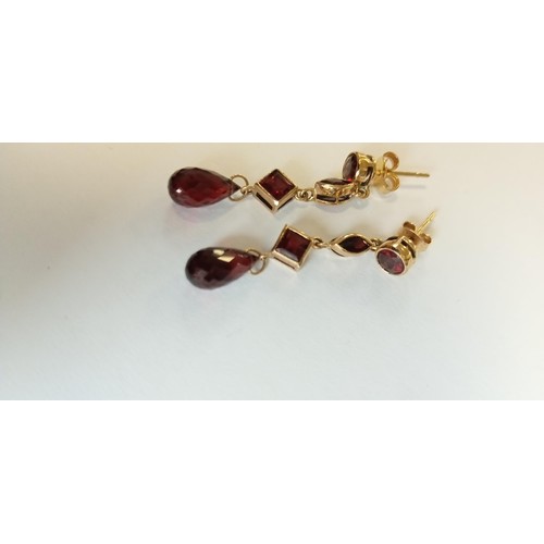 125 - 9ct gold fully hallmarked pair of earrings with stones (possibly garnet)