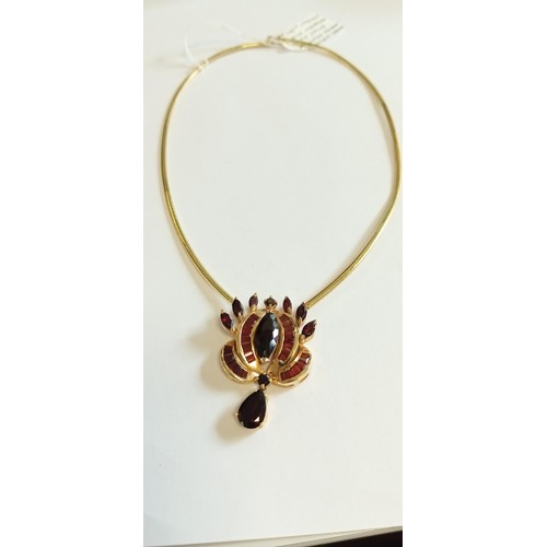 143 - 14ct Italian gold necklace with stone mounted pendant possibly garnet 30g approx.